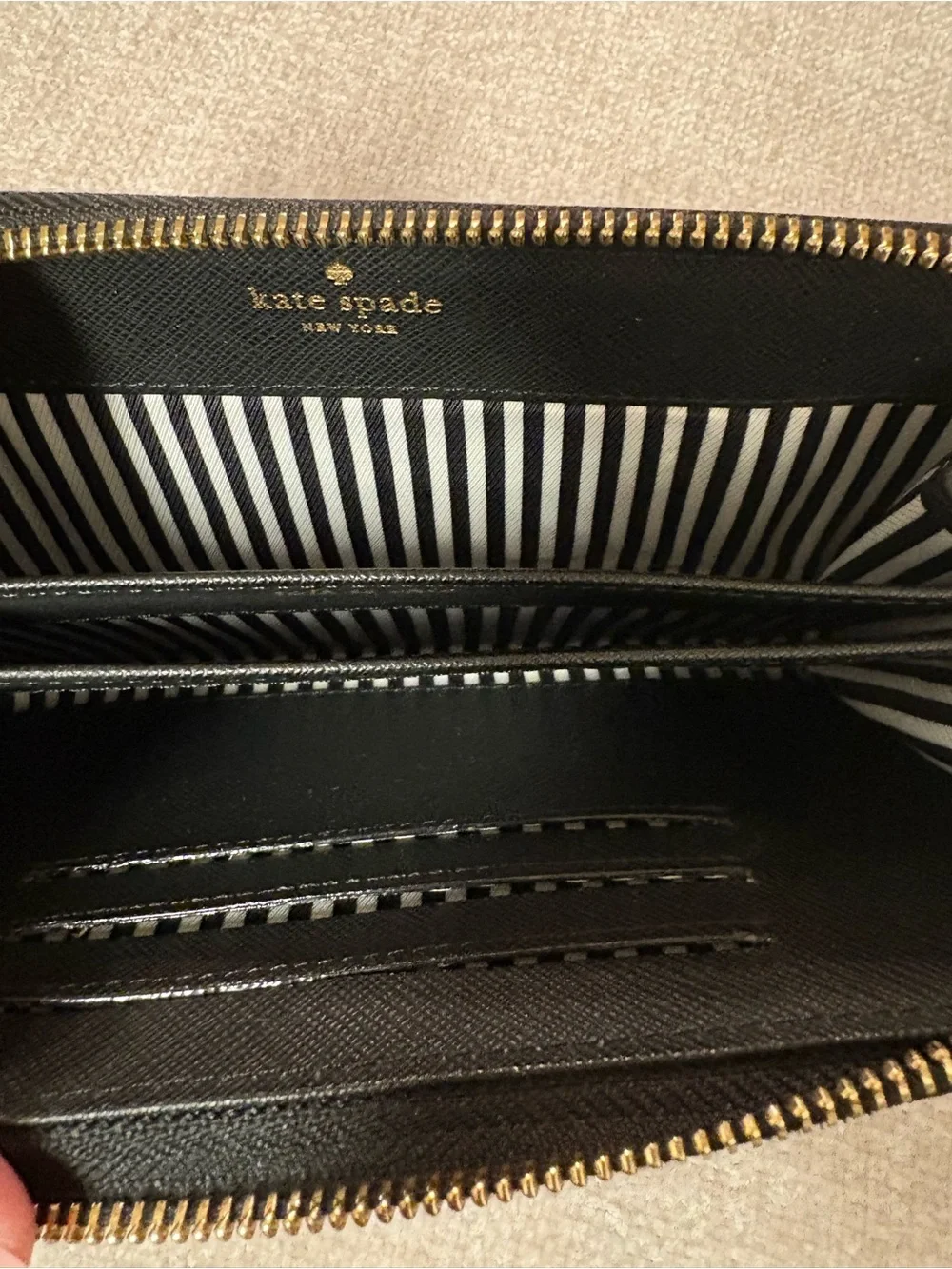 kate spade Black Zip-Around Wallet with Gold Logo